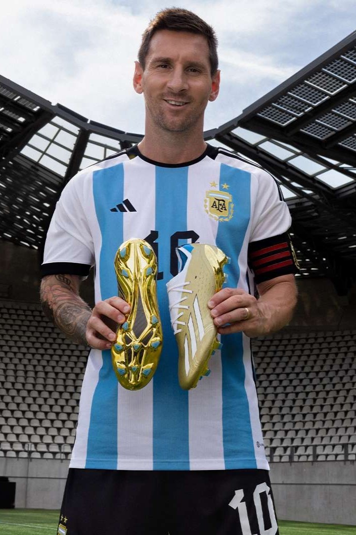 Ronaldo holds a red and black cleat